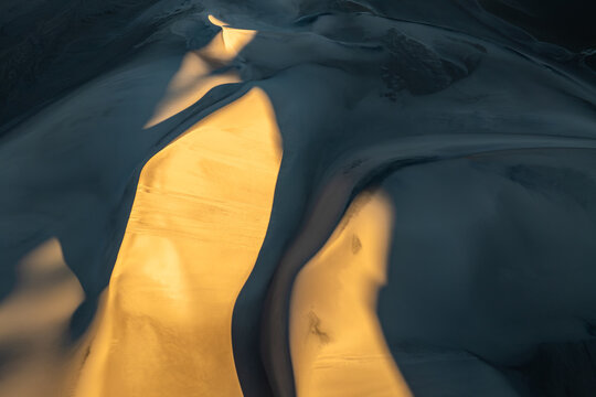 Abstract sunlit sand dune pattern texture background