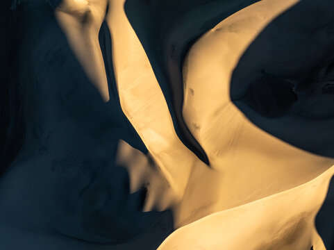 Abstract dune pattern with dramatic light and sand texture