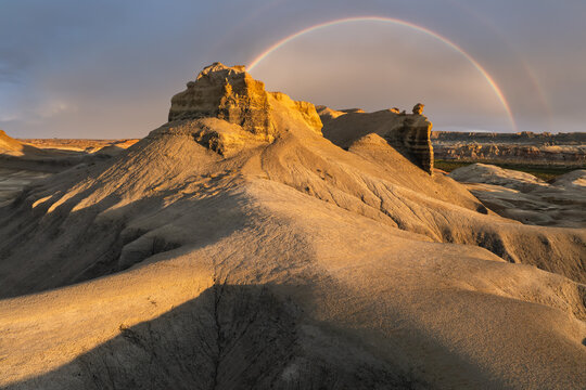 Rainbow over sandstone badlands in the American Southwest