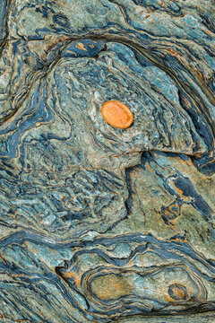 Abstract metamorphic rock texture with blue-green veins