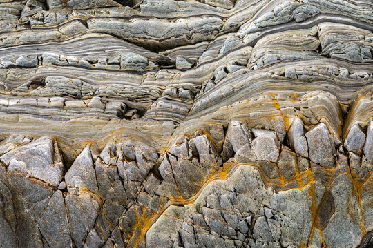 Abstract metamorphic rock texture with layered stone pattern