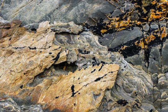 Metamorphic rock texture with layered abstract stone pattern