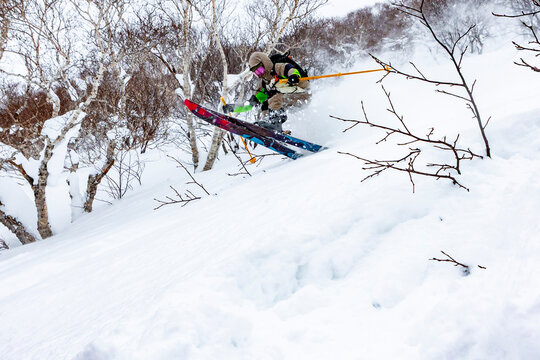 Skiing through powder in Hokkaido, Japan