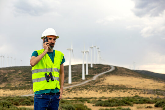 Wind farm technician on call at renewable energy site