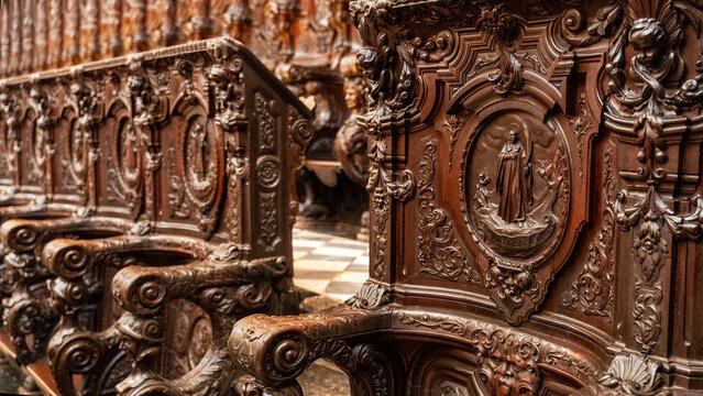 Carved wooden choir stall in historic Cordoba Cathedral