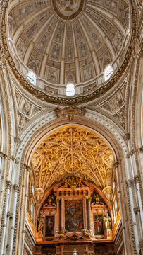 Ornate cathedral apse and dome interior in Cordoba