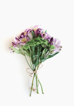 Yellow and purple Alstroemeria bouquet on white background