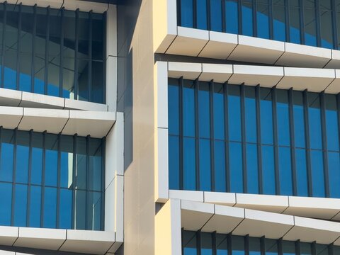 Modern glass building facade with blue window pattern