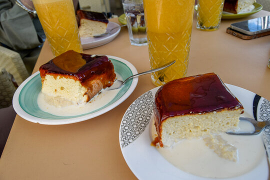 Delicious slices of tres leches cake with drinks
