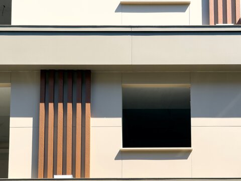 Modern building facade with window and vertical wood slat