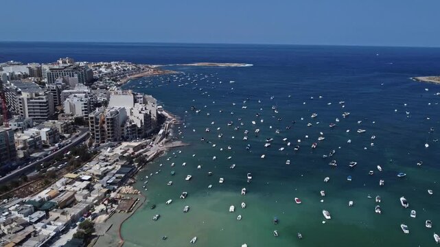 Naxxar, Malta 25.07.2026 - Salina bay and nature reserve, overlooking Qawra. aerial, archival