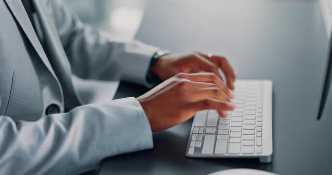 Close up shot of person typing on white keyboard in office environment motion