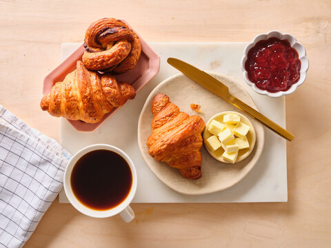 Delicious breakfast setting with croissants and coffee