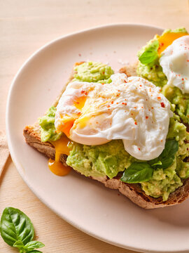Brunch with avocado sandwich and poached egg