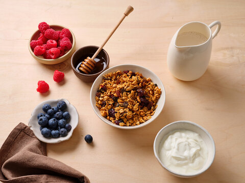 Delicious breakfast with granola, honey, and fresh fruit