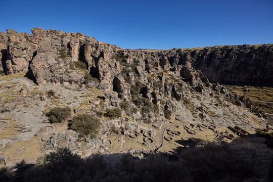 T'aqrachullo rises like a forgotten city carved into stone. Spread across seventeen hectares of windswept mesa in Espinar, Cusco, this ancient citadel holds nearly six hundred structures shaped by War