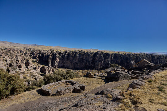 T'aqrachullo rises like a forgotten city carved into stone. Spread across seventeen hectares of windswept mesa in Espinar, Cusco, this ancient citadel holds nearly six hundred structures shaped by War