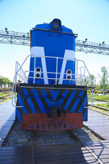 Front Close-up of Vintage Blue and White Diesel Locomotive © Lijuan