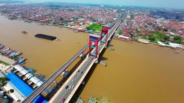 Aerial view of iconic Ampera Bridge and Musi River in Palembang