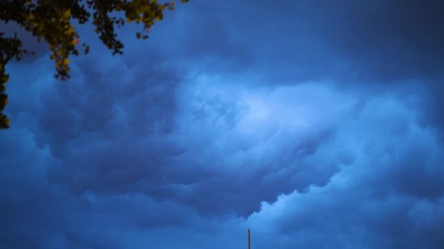 4k real time footage of rain clouds moving in sky before raining, dramatic dark clouds rolling cross sky like painting.