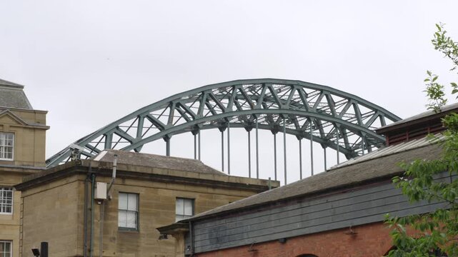 Iconic Tyne Bridge Arch Rises Above Historic Quayside Buildings in Newcastle upon Tyne, England