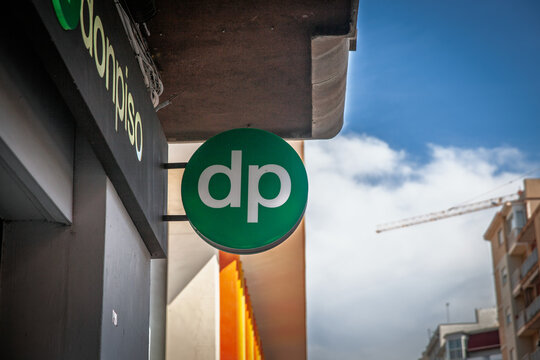VALENCIA, SPAIN - FEBRUARY 27, 2026: DP logo and donpiso signage mounted on an office, Donpiso is a spanish chain of real estate agency, on property sales, rentals in the Spanish housing market.