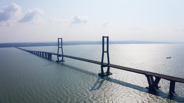 Aerial drone view of Suramadu Bridge pylon tower in Surabaya