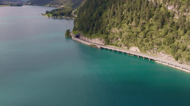 Aerial View of Scenic Road Along Turquoise Achensee Lake in Tyrol, Austria