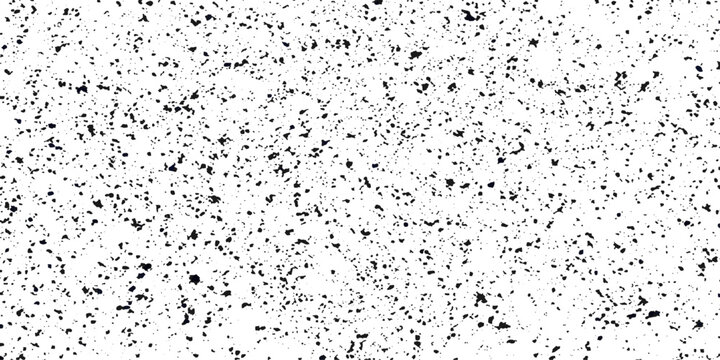 A busy abstract speckled pattern with a random distribution of tiny dark spots on a stark white background, creating a minimalist textured design.
