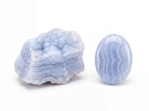 Natural blue lace agate gemstone polished cabochon and rough specimen on white background