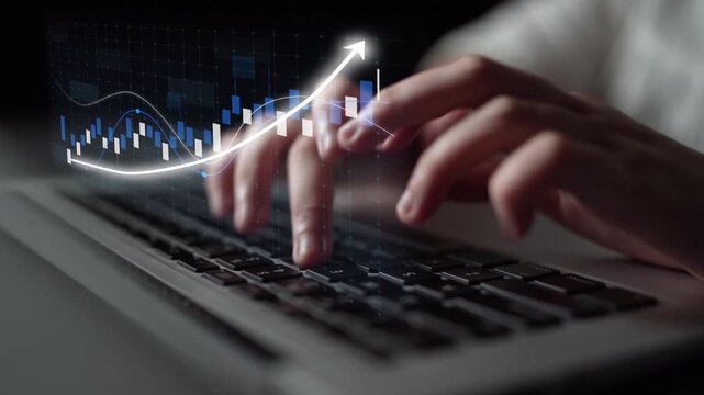 A close-up of hands typing on a laptop keyboard, overlaid with a digital finance chart and growth arrow, showcasing data trends and analysis in a modern workspace. Copula