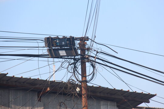 elecommunication Infrastructure with Fiber Optic Cables and Utility Pole