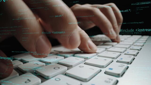 A close-up view of hands typing on a laptop keyboard with streaming digital code in the background, showcasing the essence of coding and technology in a modern workspace. Xenic