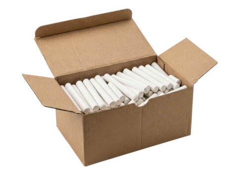 Open cardboard box filled with many small white sticks or chalk pieces inside