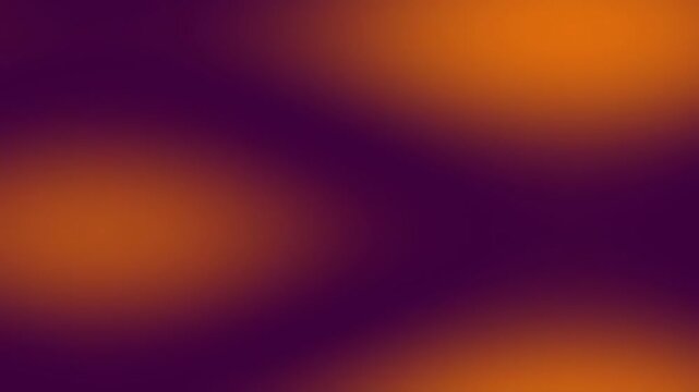 Vibrant orange and purple abstract blurred spots motion