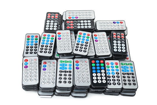 Photo of pile remotes isolated on a white background.