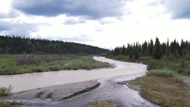 4K, 59.94fps. Very low-altitude aerial hugging the Little Nelchina River near Eureka, Alaska, flying low enough to reveal the current flowing beneath.