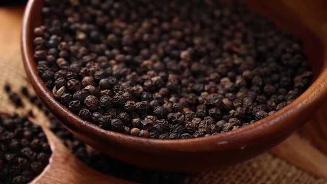 Black Peppercorns in Wooden Bowl	