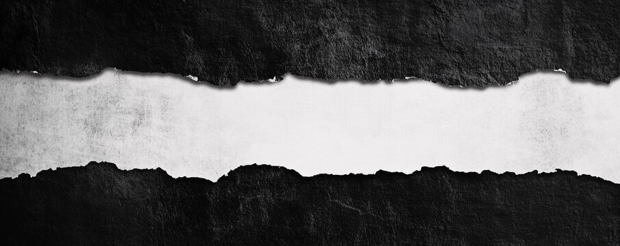 Abstract monochrome paper tearing showing texture and light