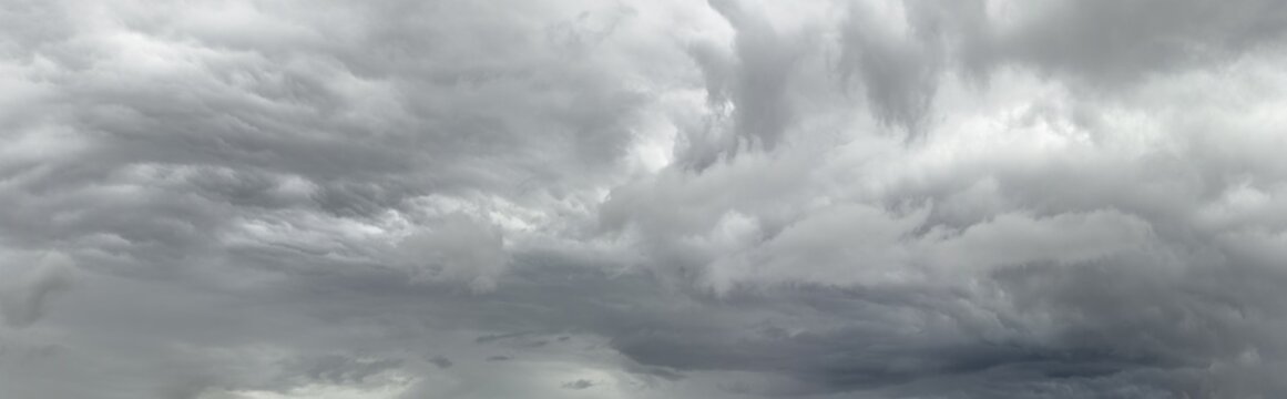overcast sky cloudscape with dark gloomy clouds before thunderstorm. panoramic view.