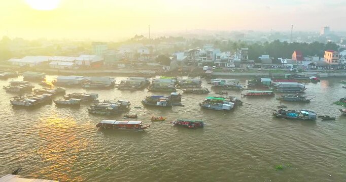 Bustling morning at Cai Rang Floating Market in Can Tho, Vietnam, where dozens of boats trade fresh fruits and agricultural products along the Mekong River