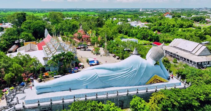 Majestic reclining Buddha statue at Som Rong Pagoda in Soc Trang, Vietnam, viewed from above on a bright sunny day. 
