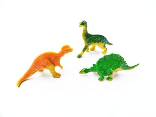Fototapeta premium A collection of colorful, soft rubber dinosaur figurines intended for children's play.&nbsp;