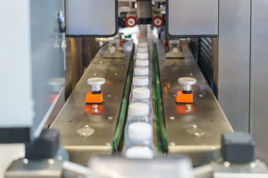 Empty Plastic Bottles on Production Line Conveyor