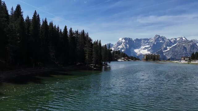 Ultra Low Water Surface Glide Tracking Towards Giant Snowy Mountain Wall
