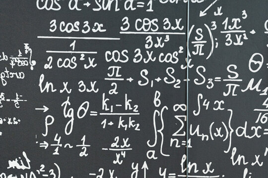 mathematical formulas, equations and geometric diagrams on black chalkboard