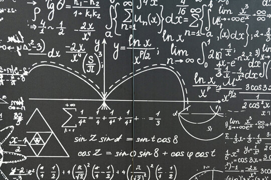 mathematical formulas, equations and geometric diagrams on black chalkboard