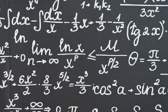 mathematical formulas, equations and geometric diagrams on black chalkboard
