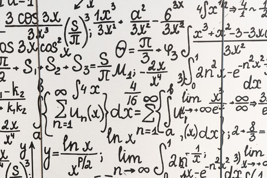 mathematical formulas, equations and geometric diagrams on chalkboard
