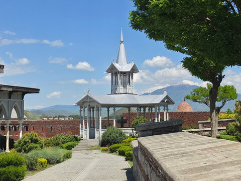 White ornamental wooden gazebo and pavilion in Rabati Castle garden at Akhaltsikhe, Georgia
